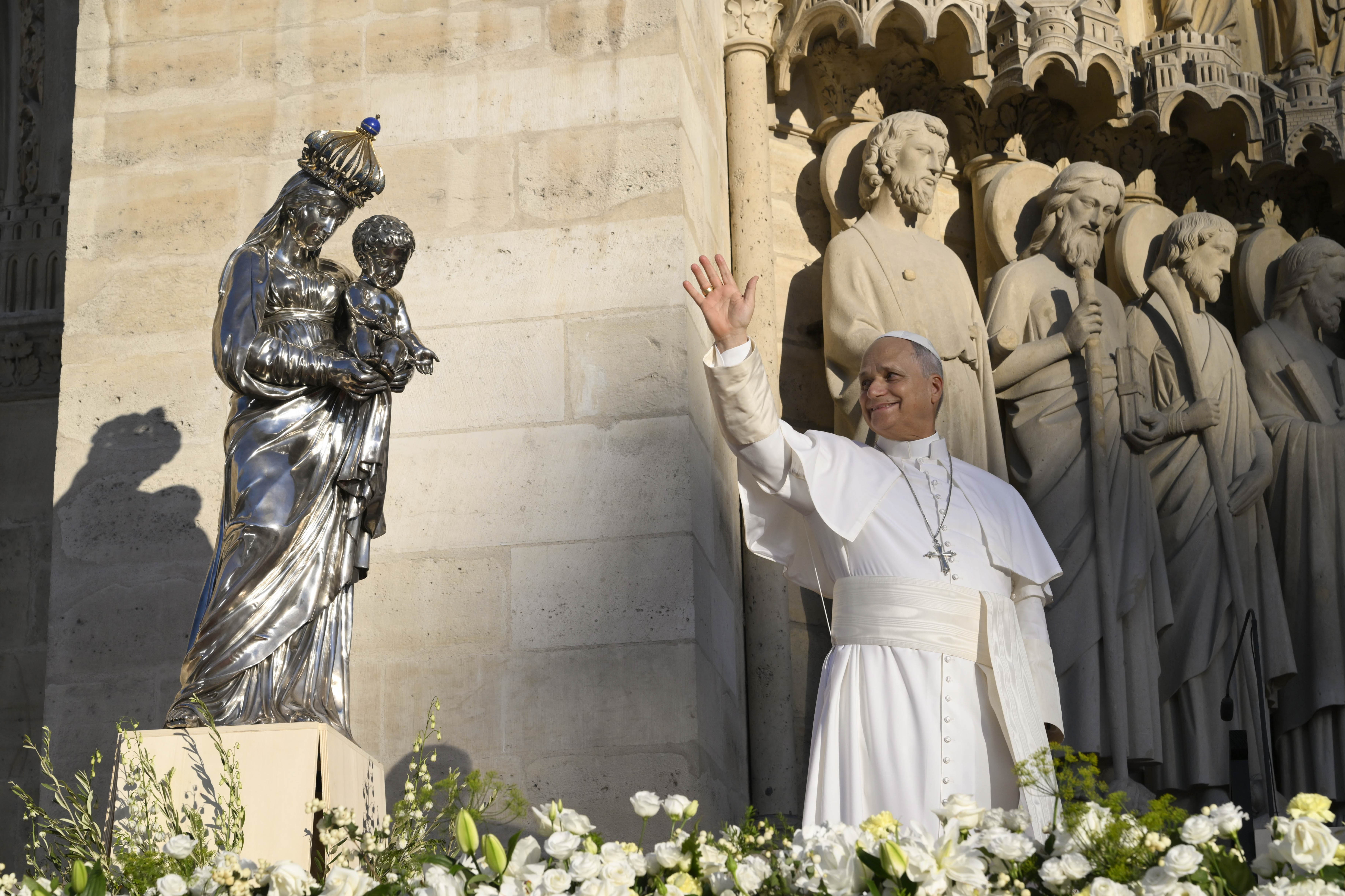 Pope Leo XIV waves at thousands of people gathered outside Notre-Dame Cathedral in Paris on Sept. 25, 2026 to pray the Salve Regina. | Credit: Vatican Media