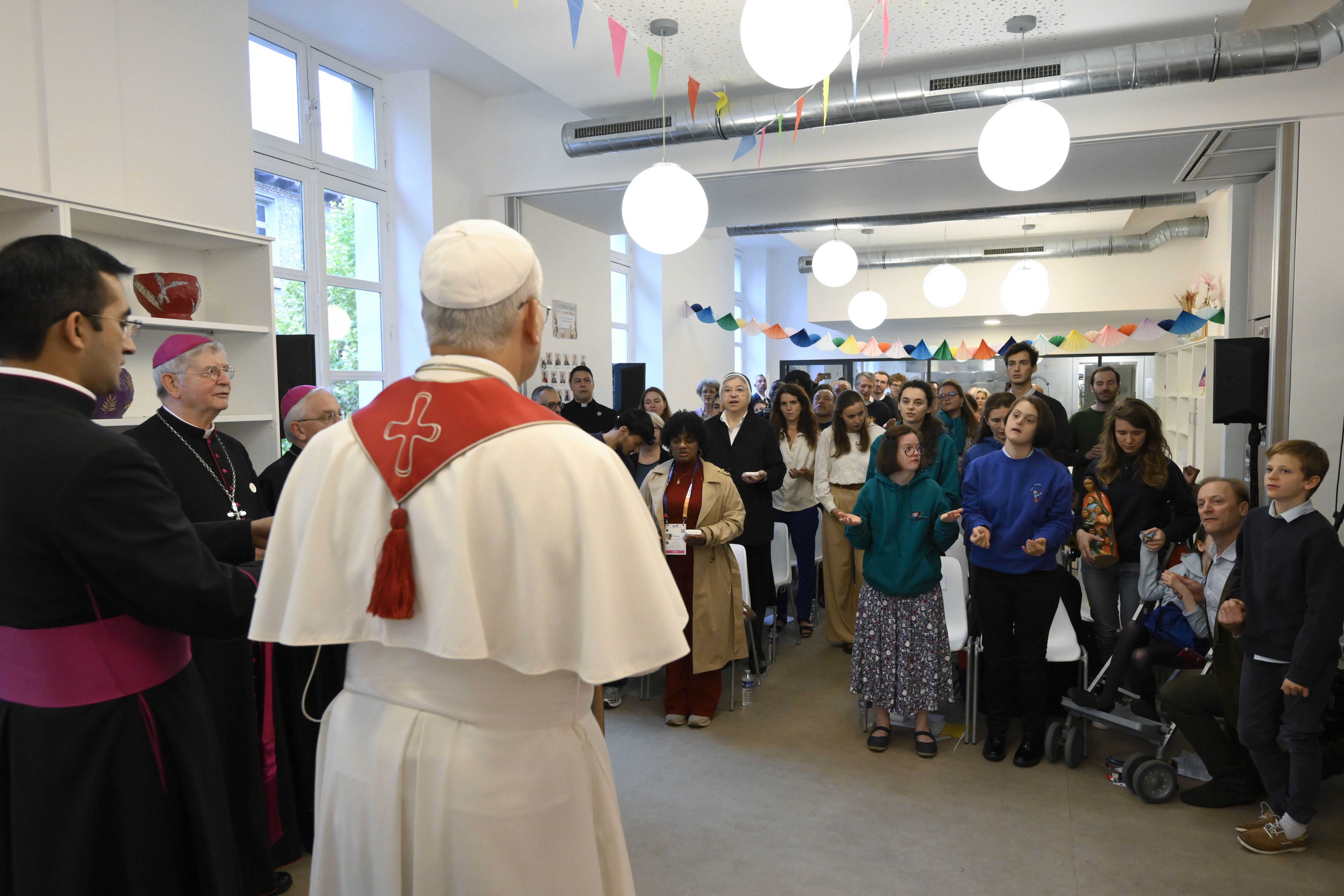 Pope Leo hears testimony of migrants in Paris: God opened ‘a new path for me’