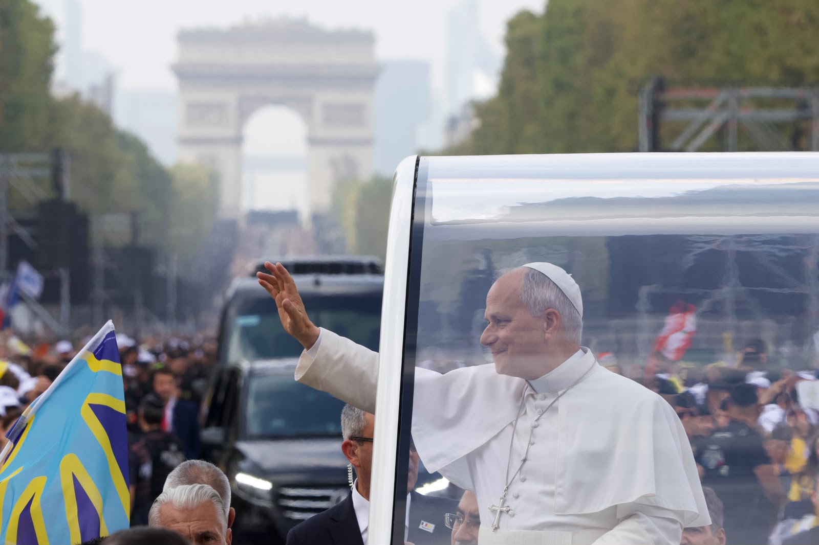 Pope Leo XIV waves to the crowds gathered along the Avenue des Champs-Élysées as he rides in the popemobile on the way to Mass at Paris' Place de la Concorde on Sept. 26, 2026. | Credit: Daniel Ibáñez/EWTN News