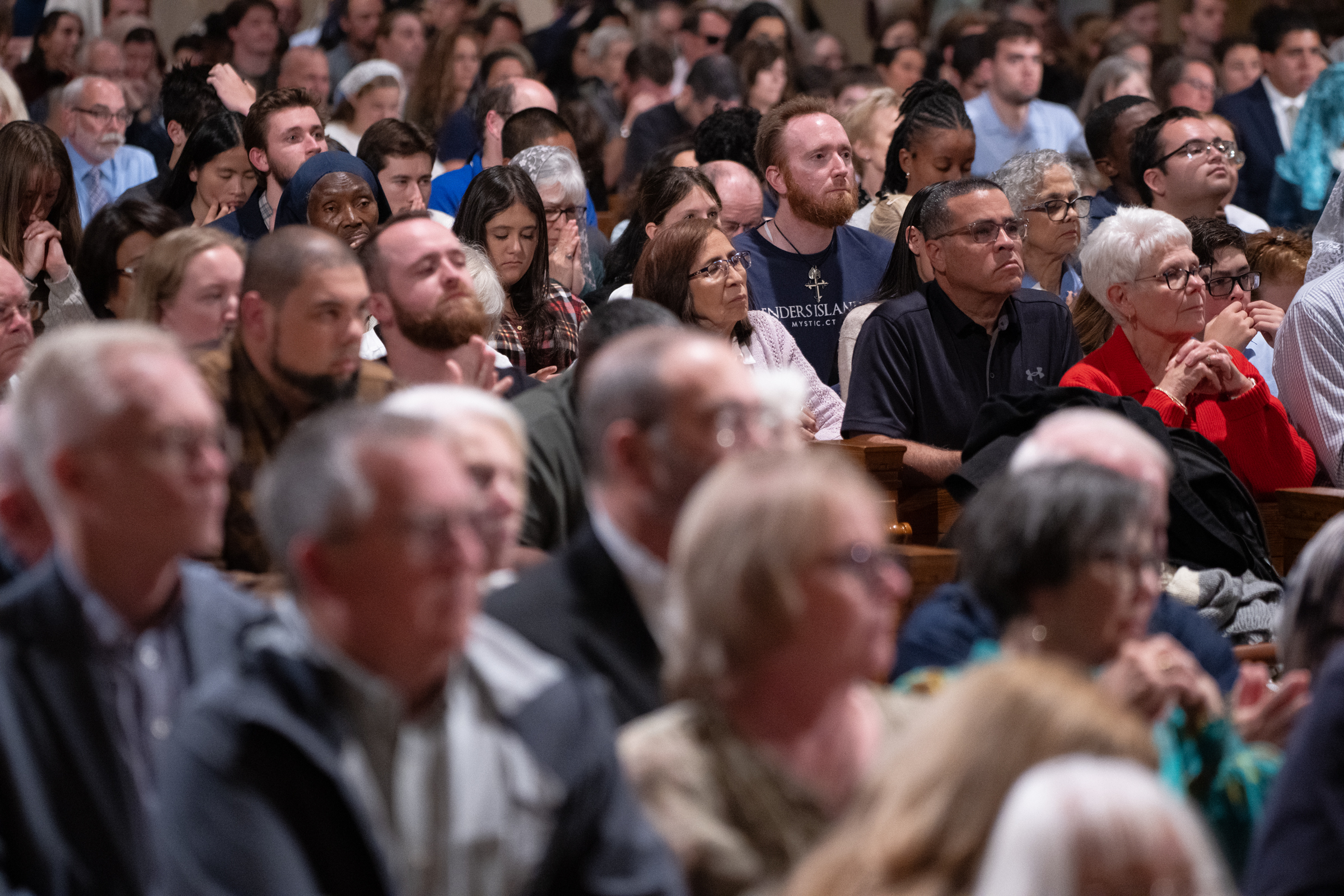 Pilgrims sit shoulder to shoulder in the basilica, some with hands clasped in prayer, during the Vigil Mass at the Basilica of the National Shrine of the Immaculate Conception in Washington, D.C., for the Dominican Rosary Pilgrimage on Saturday, Sept. 26, 2026. | Credit: Jeffrey Bruno