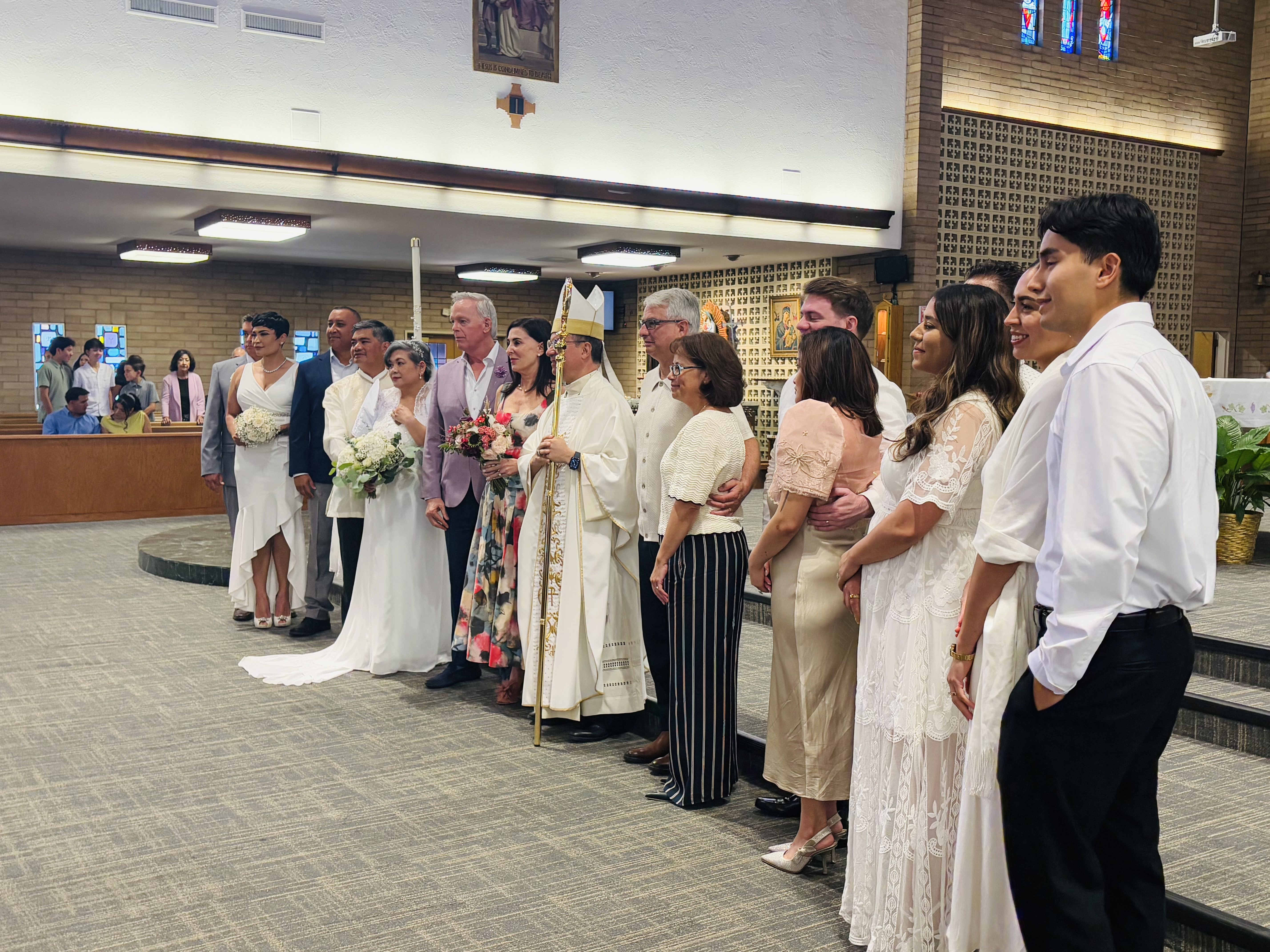 Newly convalidated couples gather around San Jose Bishop OScar Cantú in the sanctuary, marking their entry into the sacrament of matrimony. | Credit: Oliver Tapia/Diocese of San Jose