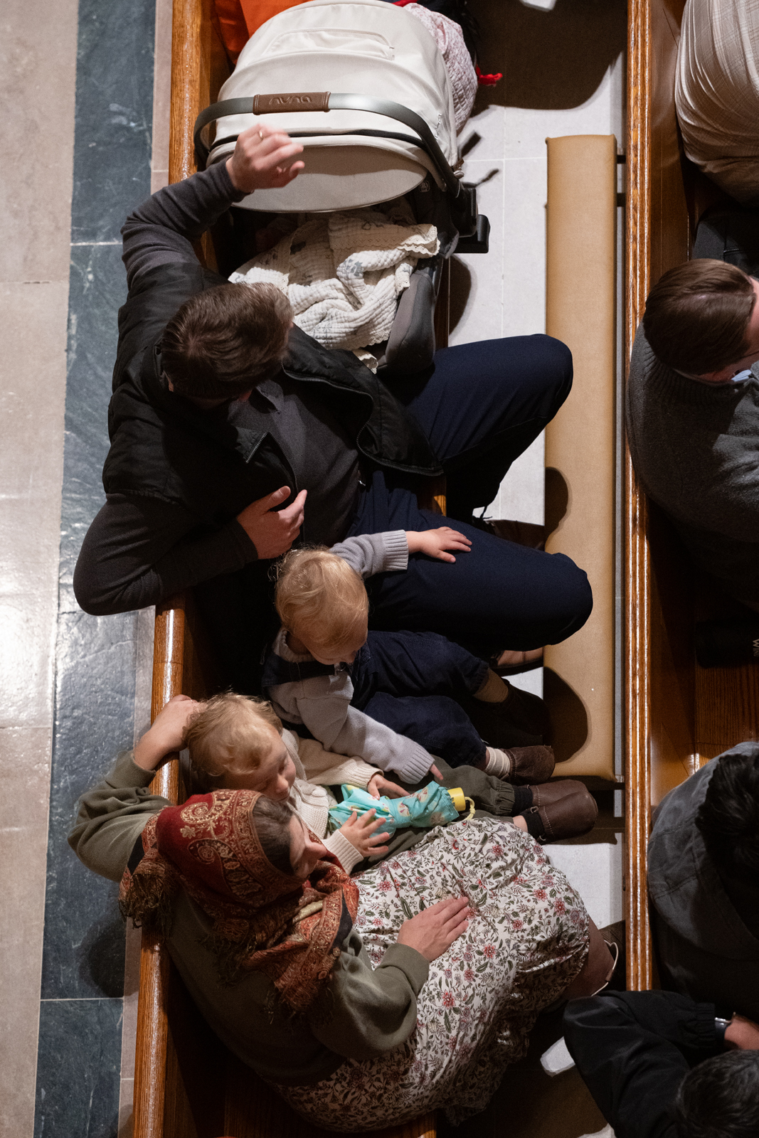 Children sit with adults beside a stroller in a crowded pew at the Basilica of the National Shrine of the Immaculate Conception in Washington, D.C., for the Dominican Rosary Pilgrimage on Saturday, Sept. 26, 2026. | Credit: Jeffrey Bruno
