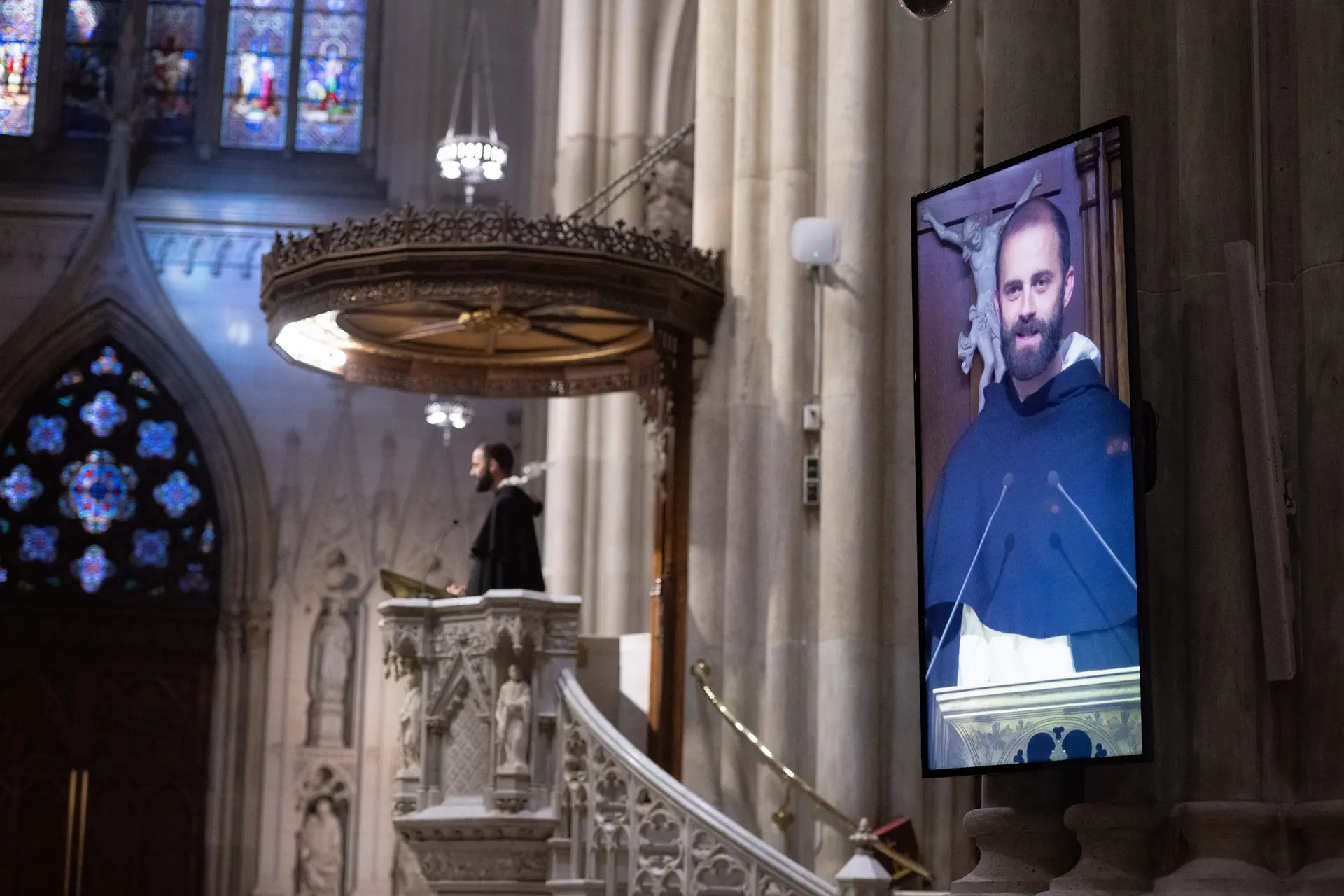 From the pulpit to a screen beside the pews to the live stream, the afternoon’s reflection reaches across the cathedral and world. An invitation to draw closer, wherever we find ourselves sitting. | Credit: Jeffrey Bruno