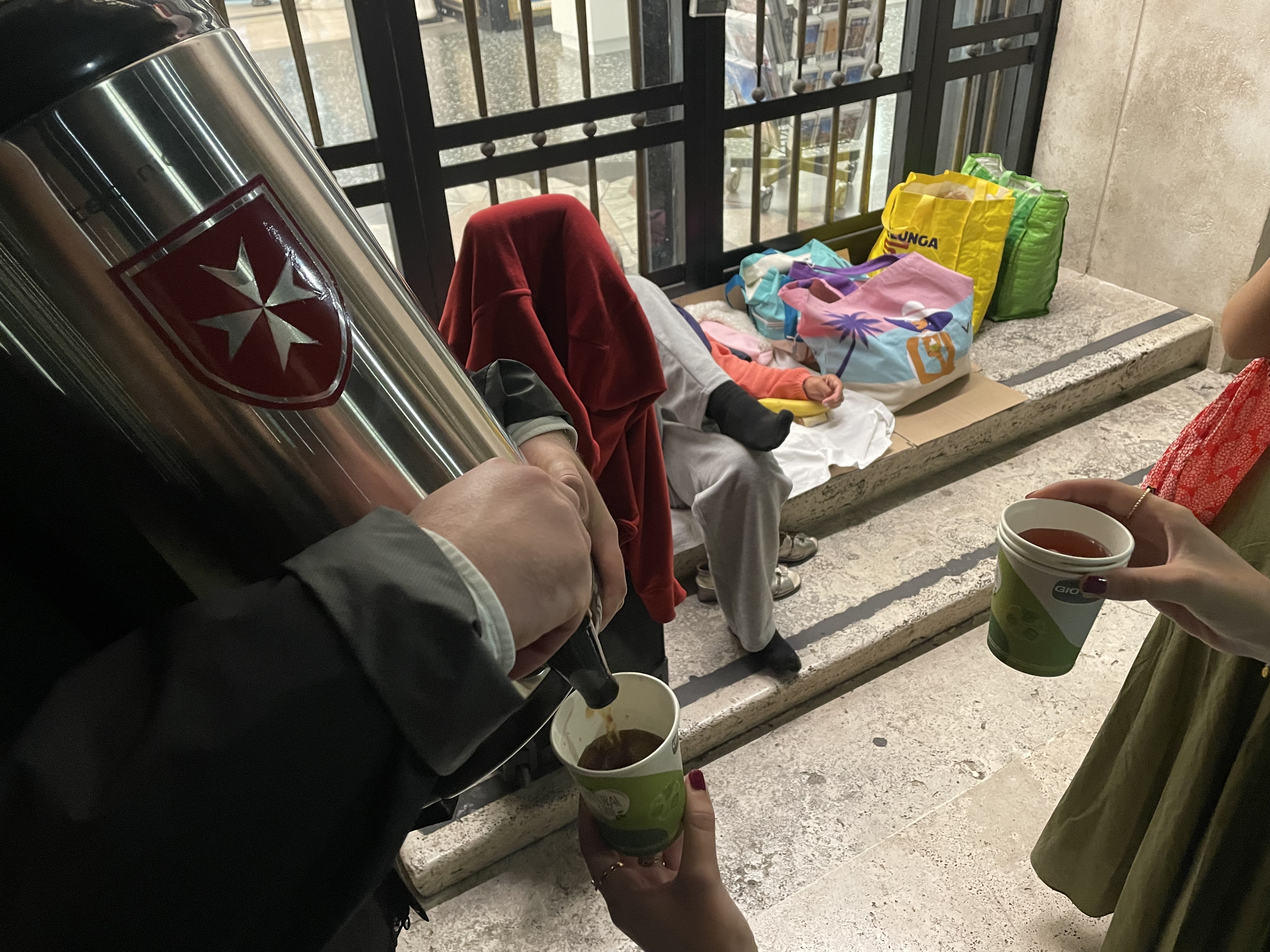 Young members of the Order of Malta help the homeless in St. Peter’s Square