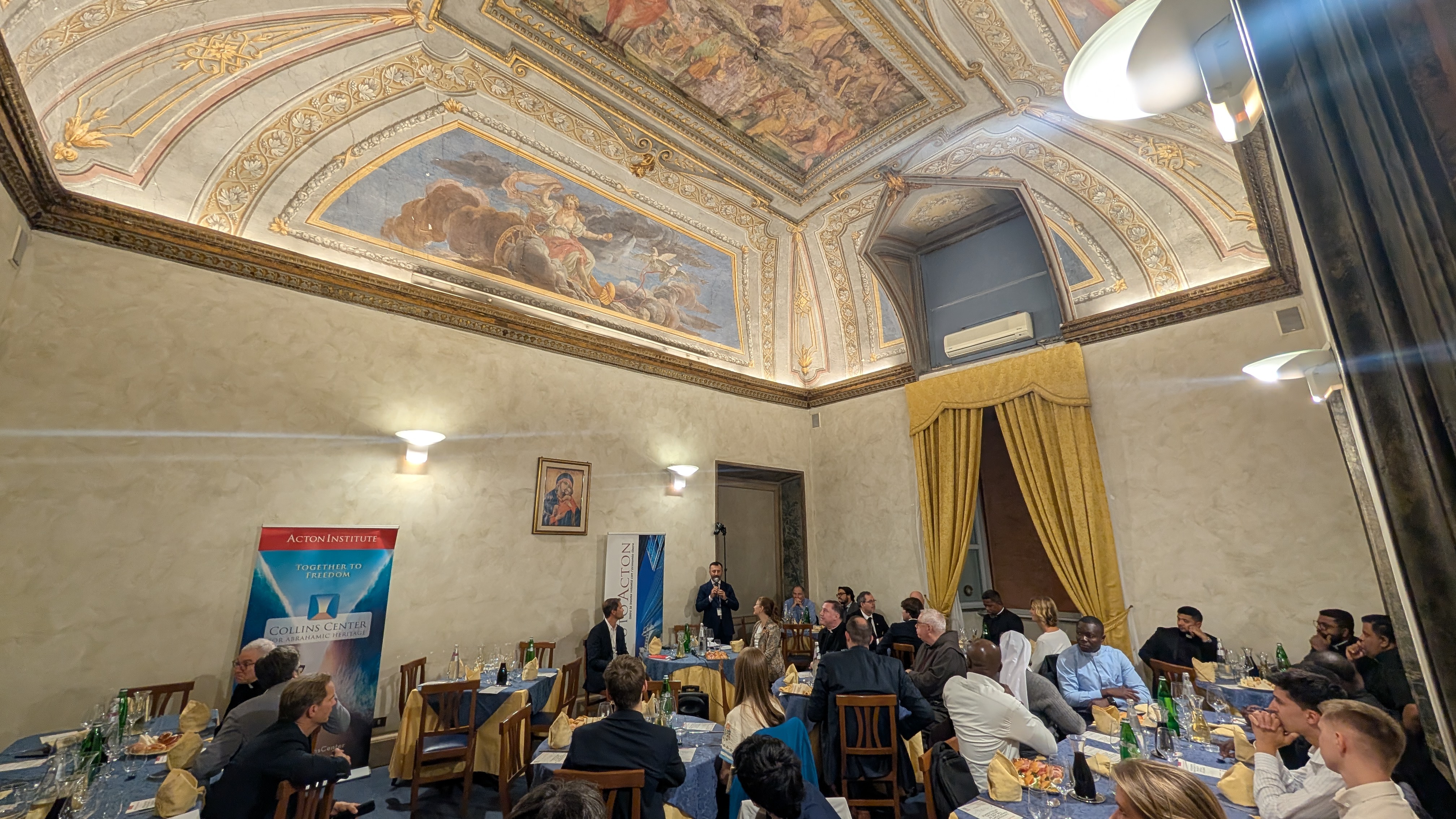 Participants listen at the conference