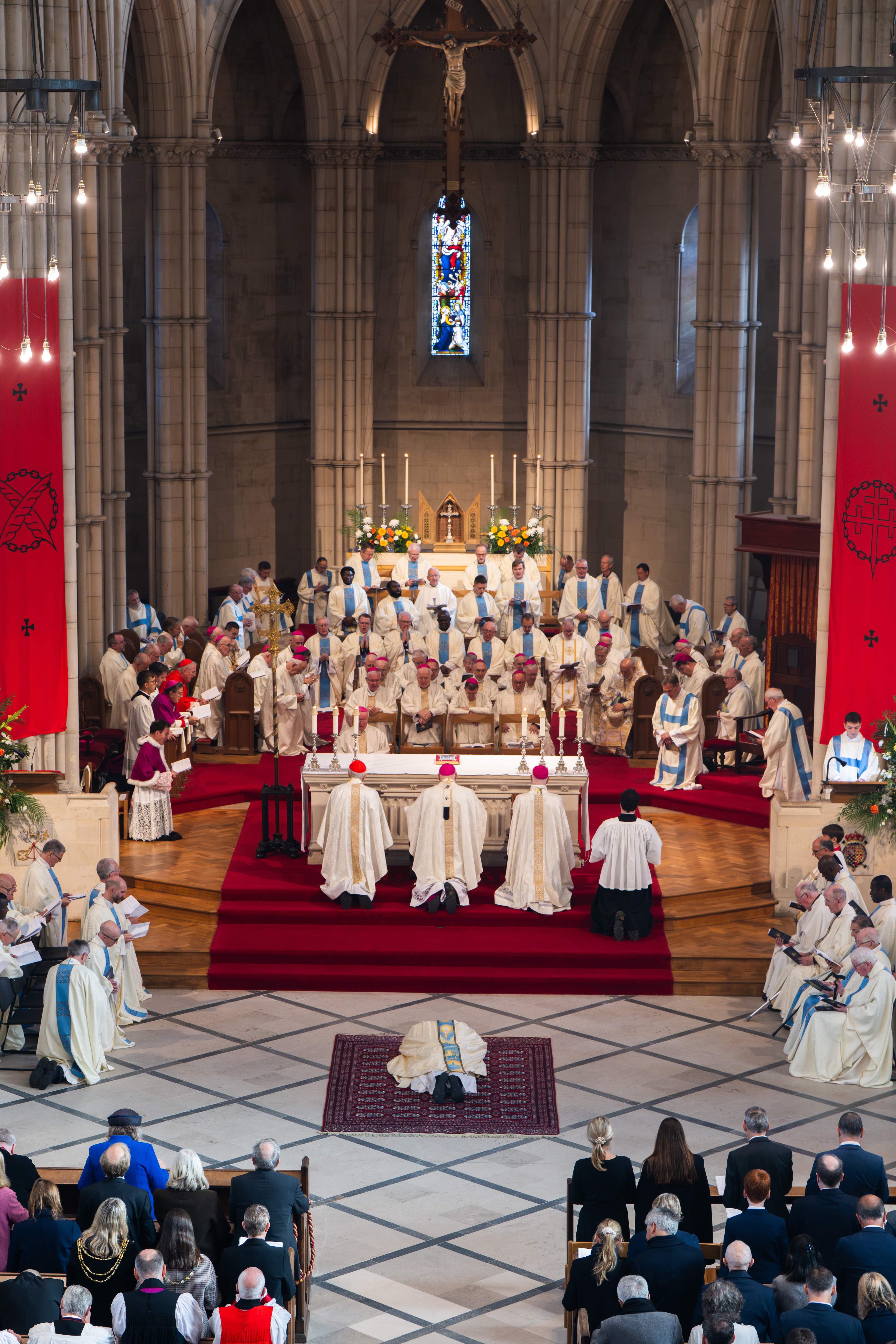 Stephen Wang lies prostrate during his ordination as the sixth bishop of Arundel and Brighton in England on Oct. 19, 2026, after serving as rector of the Venerable English College in Rome. | Credit: ©Mazur/cbcew.org.uk