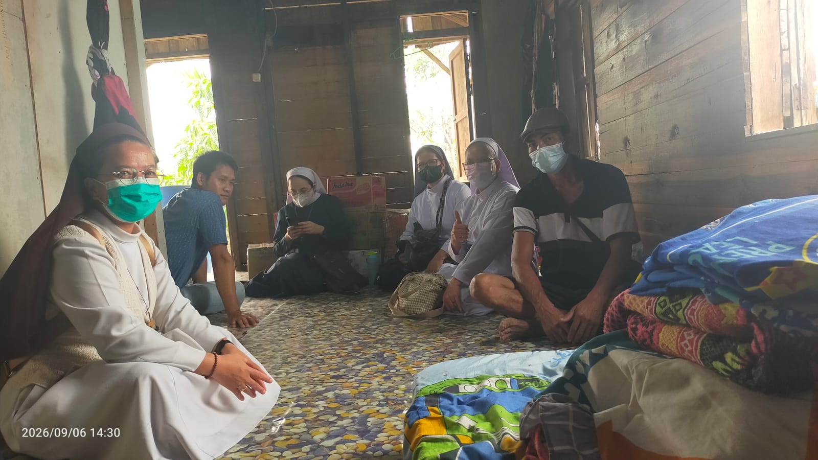 Catholic sisters visit a family whose house was destroyed by fire in Kalimantan, Sept. 6, 2026. | Credit: Photo courtesy of Friar Taucen Girsang, OFM