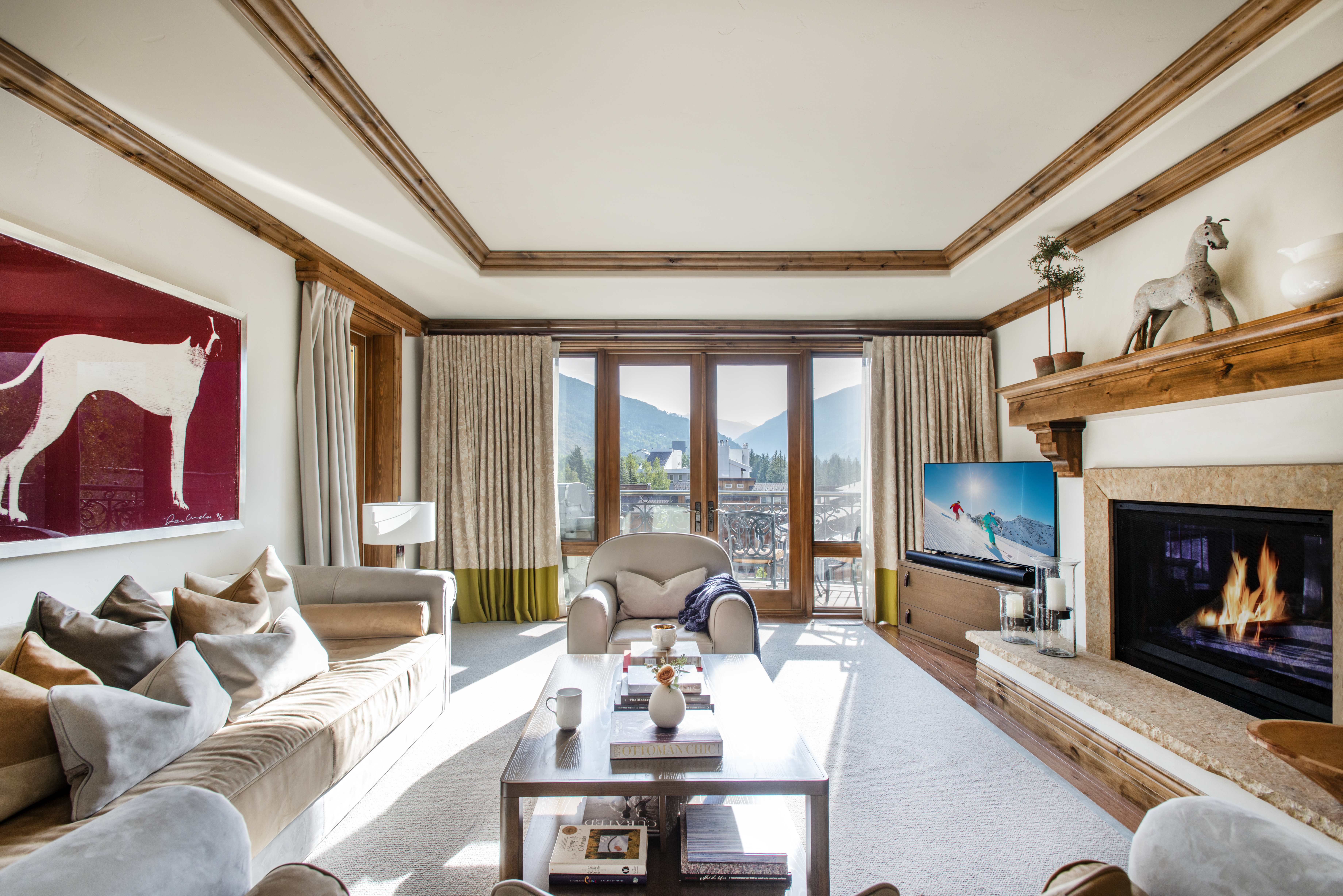 Exclusive Resorts property living room at The Arrabelle at Vail Square with mountain views and cozy fireplace.