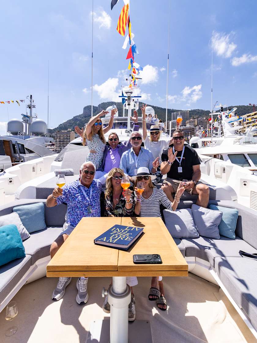 A group of Exclusive Resorts Members on a yacht in Monaco.