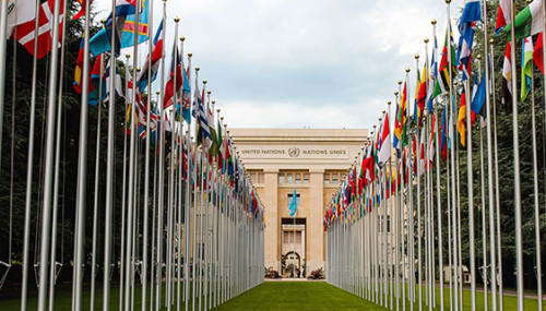 United Nations building with flags of the whole world