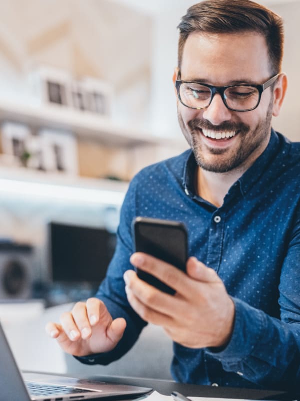 Man holding mobile phone in hands