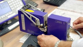 Bench-top laser micrometer for wire