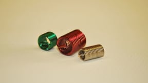 Threaded inserts and self-tapping sleeve bushings for metals