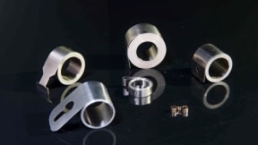 Motor brush springs for the automotive industry