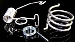 Single and double torsion springs in steinless steel, iron, and copper