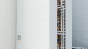 Automated storage system for bins and totes