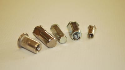 Cylindrical, hexagonal, and semi-hexagonal threaded rivet nuts for sheet metal