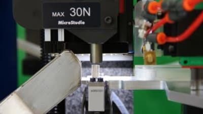 Eine neue automatische Prüfwaage zur Kraftprüfung von Kleinstfedern