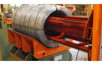 Compacting and strapping of big (bulk) coils of galvanized steel wire