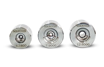 Tungsten carbide extrusion dies and tapered inserts