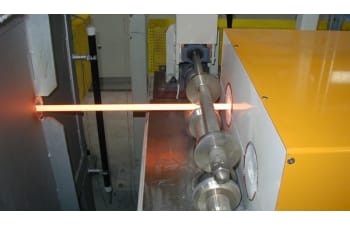Induction heating systems for heat treatment of wire and profiles