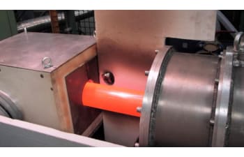 Induction heating systems for heat treatment of pipes