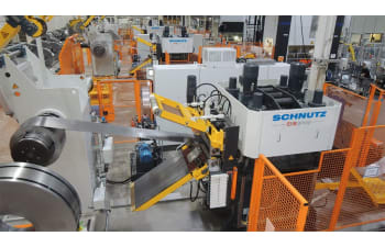 Strip feeding lines for precision coil line integration