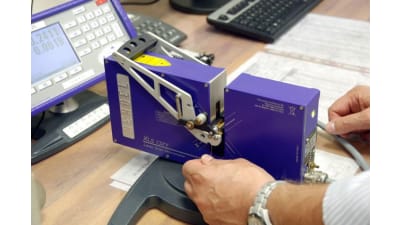 Bench-top laser micrometer for wire