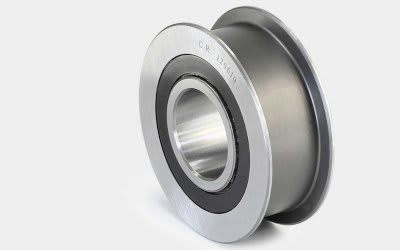 Metallic grooved pulley with a sealed bearing, marked CR 129610