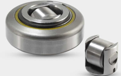 Spherical roller bearing with a visible yellow seal, displayed alongside a separate, smaller metallic roller component.