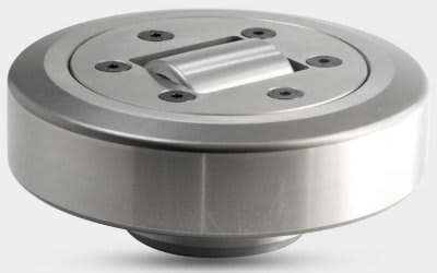 Precision metal rotary component with a central pivoting bar and visible mounting screws on a circular top plate.