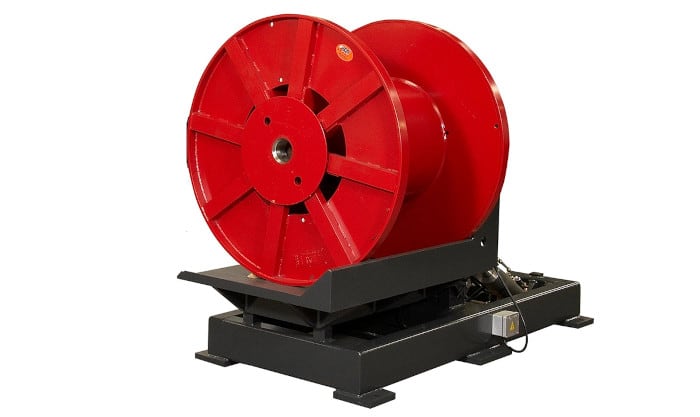 Industrial red cable reel on a black heavy-duty unwinding and winding stand