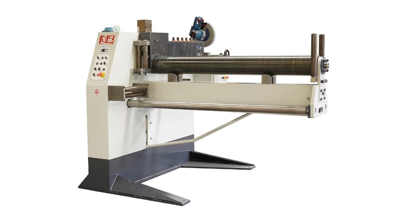 Industrial sheet metal slitting machine with large rollers and a control panel