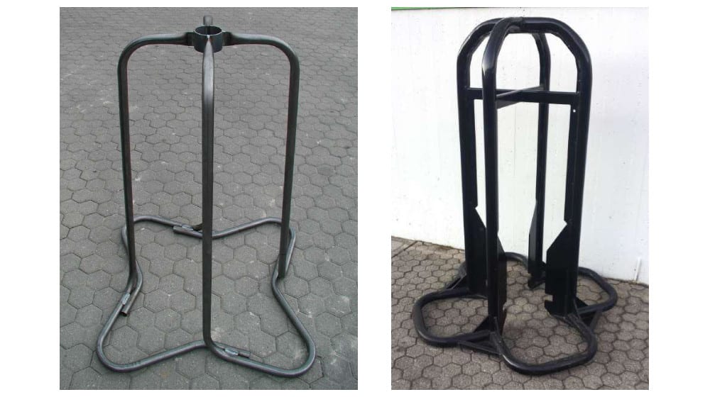 Bare metal frame and a black industrial stand side-by-side, both featuring a circular top and a sturdy tubular base, designed for vertical storage or display.