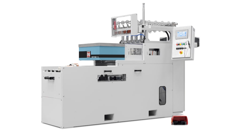 Nabruff Gruppe SMB 4 industrial processing machine featuring a white chassis, blue housing, clear feeding mechanism with spools, and a side-mounted control panel.