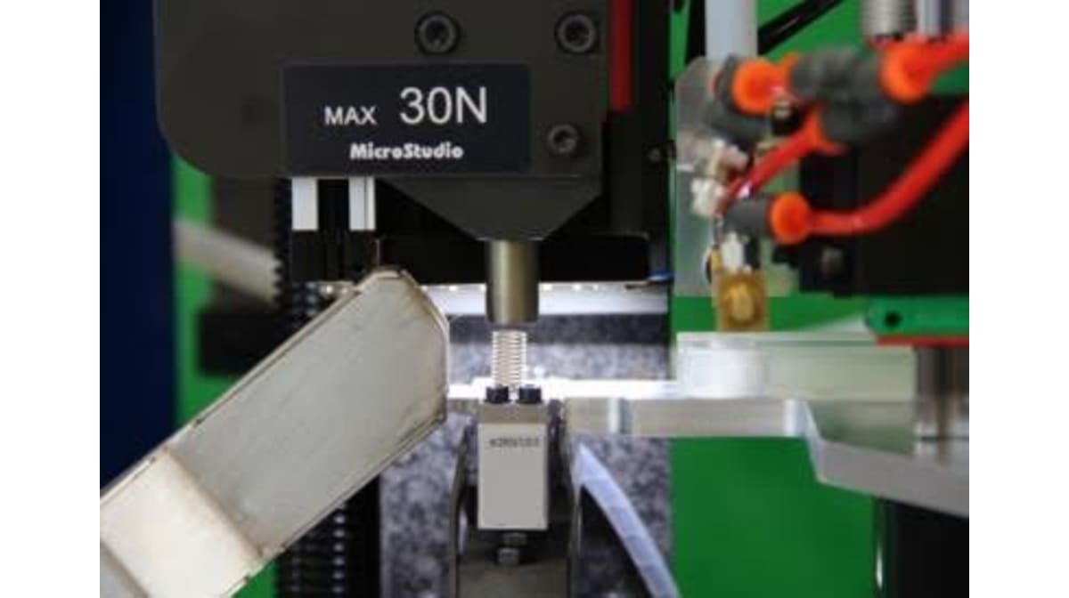 Eine neue automatische Prüfwaage zur Kraftprüfung von Kleinstfedern
