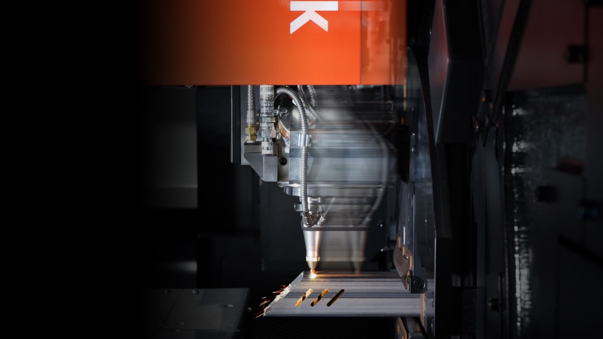 The Mazak FT-250's 3D laser head moving at high speed while cutting a tube