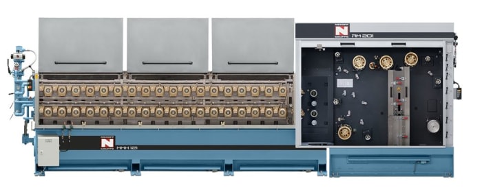 Nesbitt Gruppe H-H-I 1221 industrial processing machine with horizontal heating or drawing rollers, and an open view of the RM 201 control system featuring gold spools and thread guides.