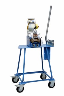 Mobile key cutting machine on a blue rolling cart workstation