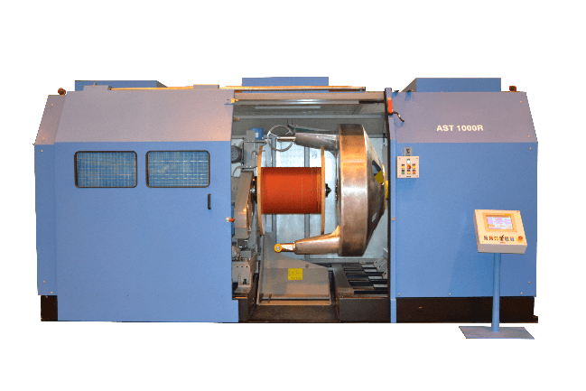 AST 1000R blue industrial cable winding machine with a large orange spool held inside, featuring a control panel and a separate touchscreen display.