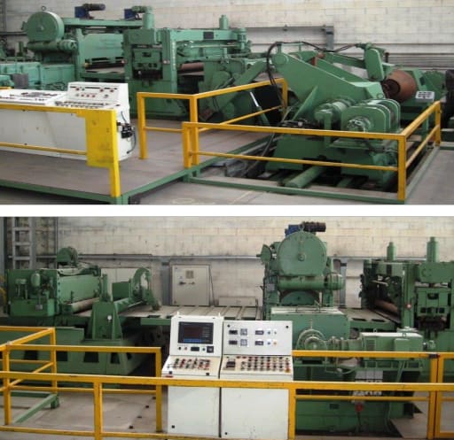 Green industrial metal processing machinery with multiple control panels and yellow safety railings inside a factory.