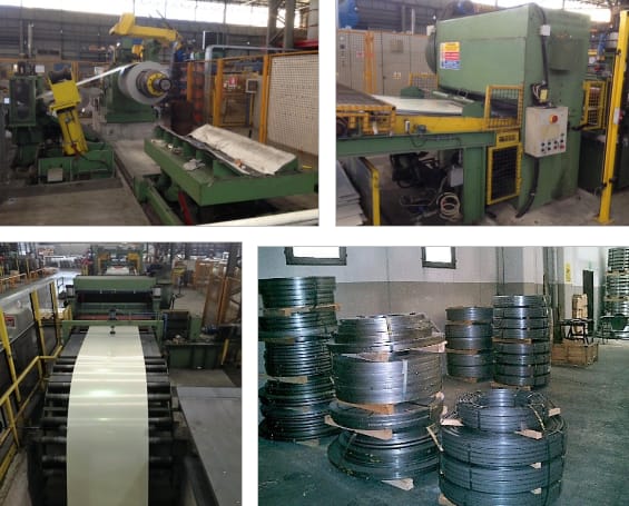 Industrial metal processing plant featuring large machinery for slitting and cutting steel coils, with a production line in operation and stacks of finished metal strips on pallets in a storage area.