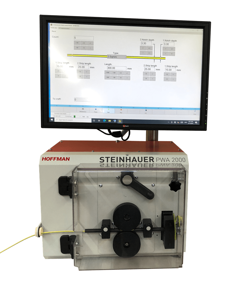 STEINHAUER PWA 2000 automatic cable processing machine with a yellow cable inserted, operated via a monitor displaying wire stripping and notching parameters.