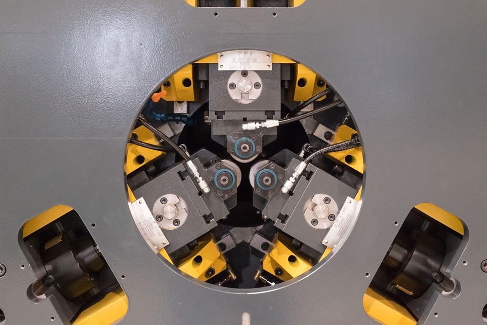 Regginspection OptoGaugeLine NANO 5AI optical measurement systems, one white and one dark gray, shown with monitors displaying precision dimensional inspection of parts.