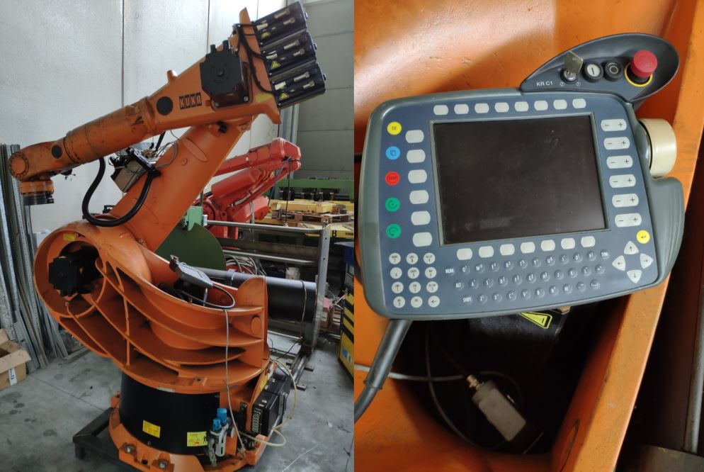 Robot industriale KUKA arancione con braccio articolato e pannello di controllo KUKA KR C1 per automazione.