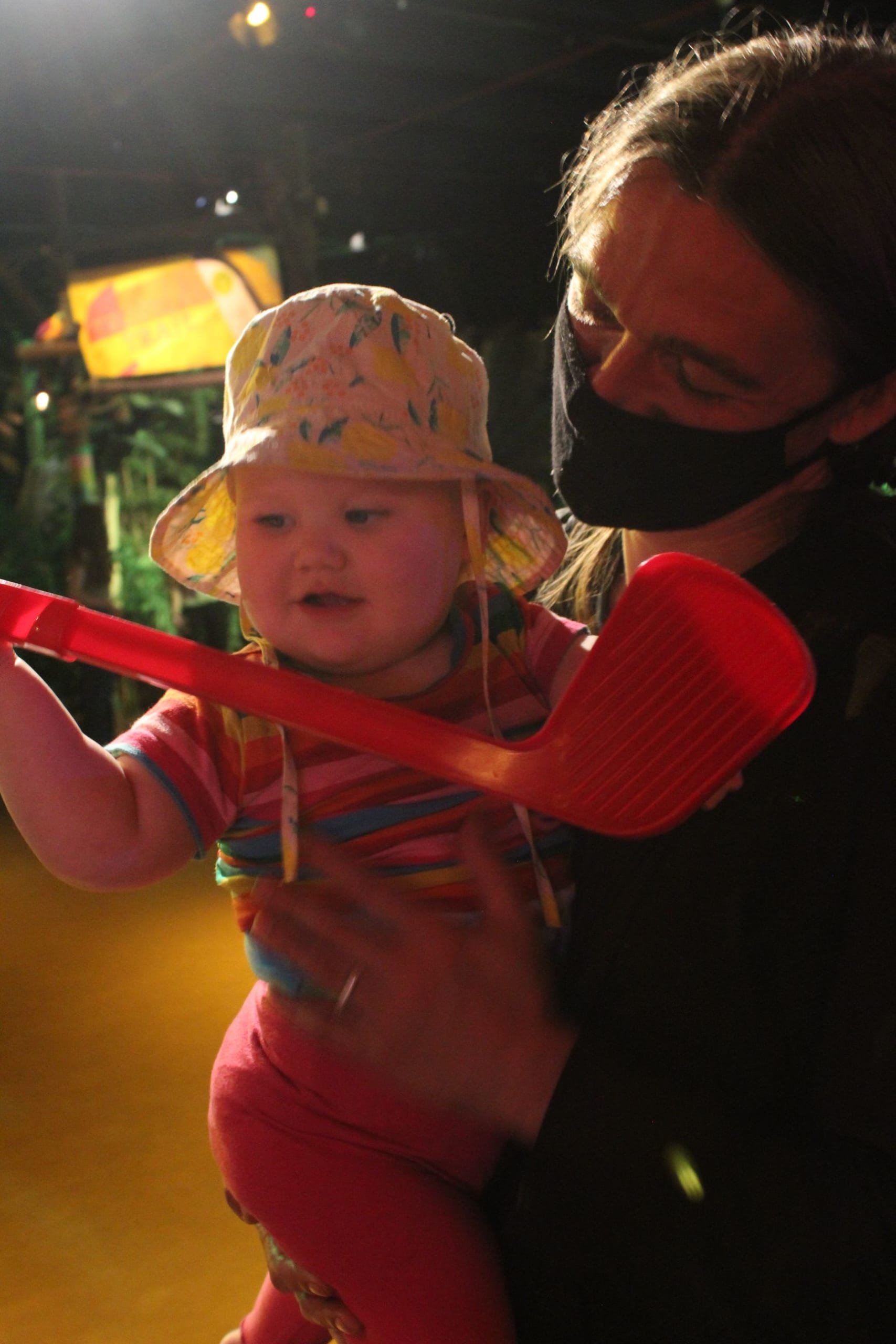 Baby playing mini golf