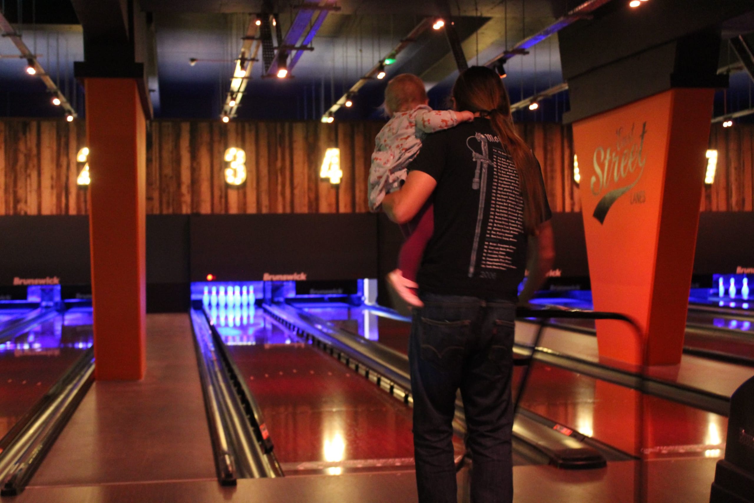 Baby learning how to bowl at East Street Lanes in Leicester