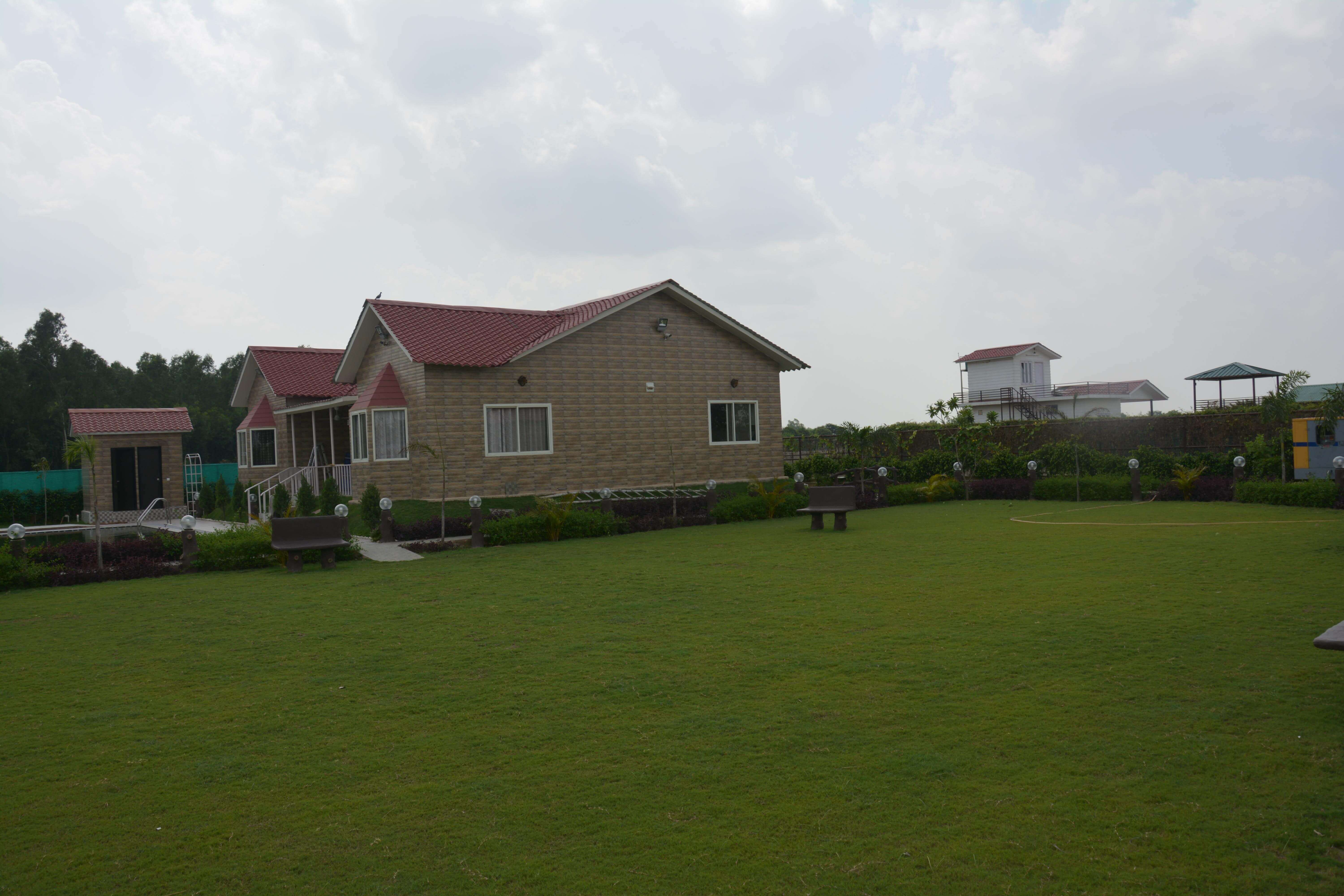 Fenced farmhouse plot for sale in Noida with plantation
