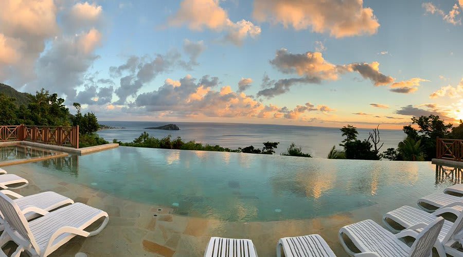 Hillside eco-villas and infinity pool of Jungle Bay overlooking Soufriere Bay, Dominica