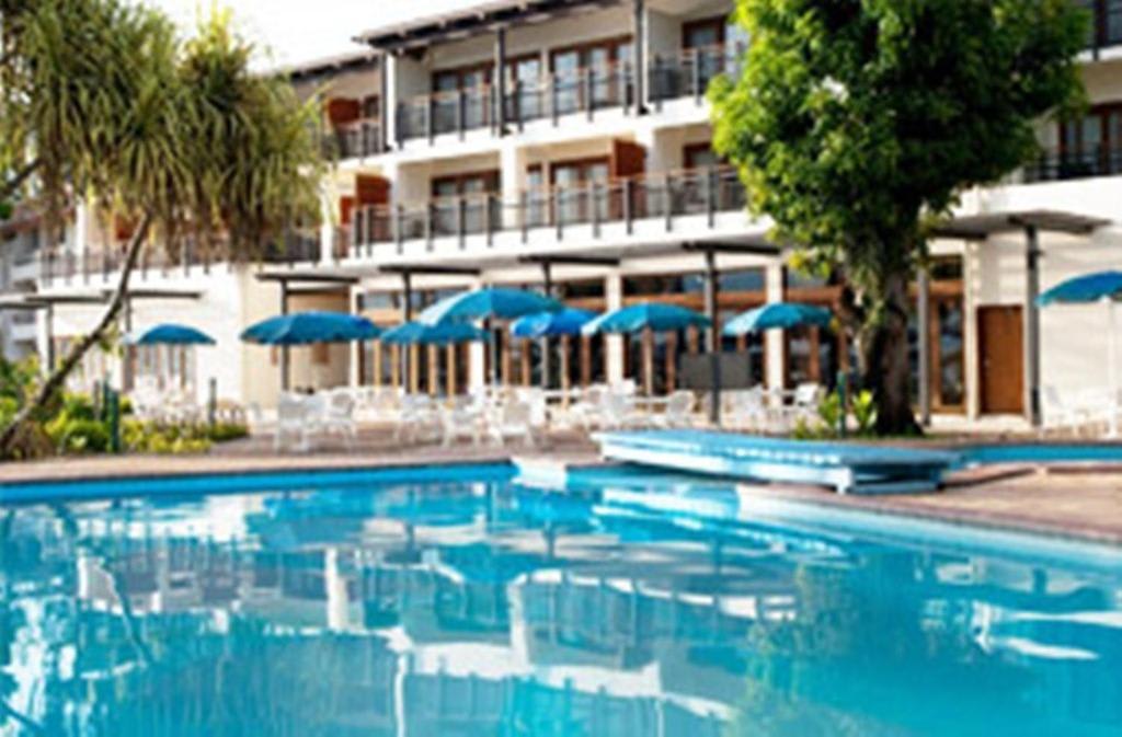 Oceanfront gardens and pool of the Solomon Kitano Mendana Hotel on Mendana Avenue, Honiara